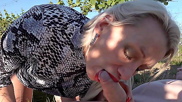 Redhead Molly Lee and friend enjoy outdoor threesome fun with a mature woman