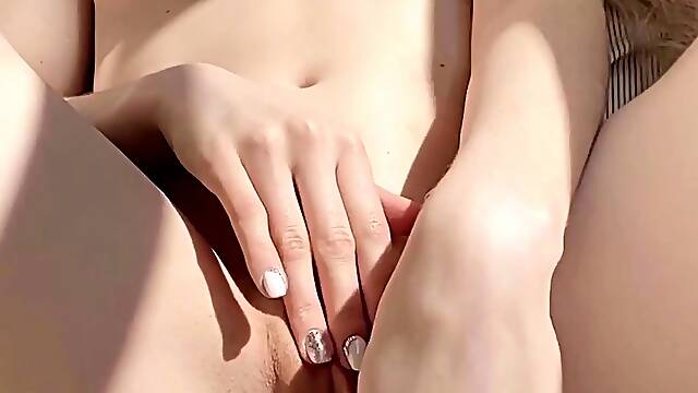 Small titted Briana toying herself poolside