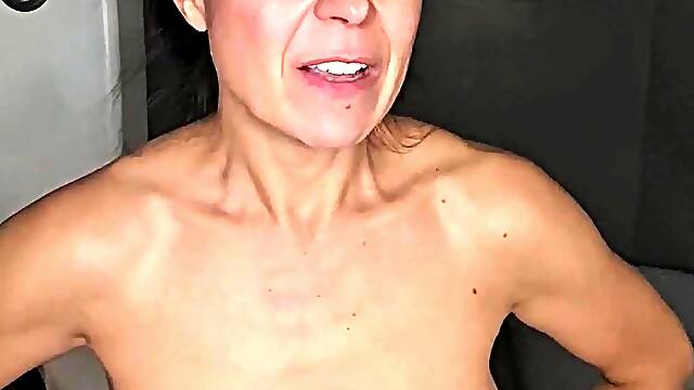Busty curly brunette with big boobs fucks on couch