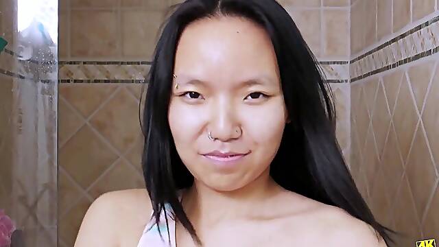 Sexy asian model enjoys a sensual bath