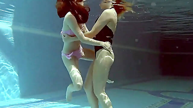 In the indoor pool &mdash; two stunning girls swim
