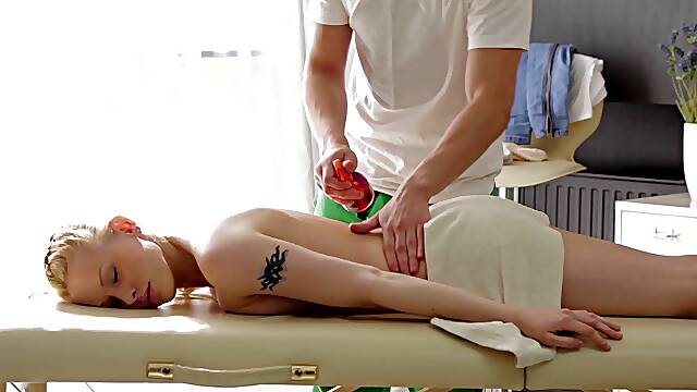 Massaging a blonde beauty with oil and getting a reward