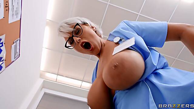Short-haired nurse in glasses fucks young Spanish dude