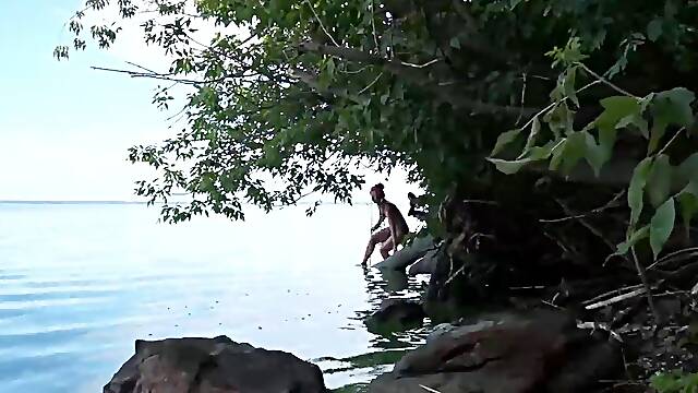 Fishing with harpoon in topless