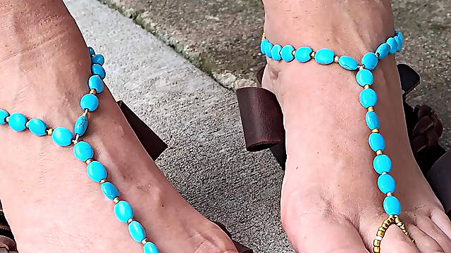 Showing off her soles and cute barefoot sandals