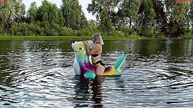 Alla hotly fucks a squeaky inflatable seal on the lake