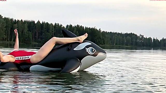 A fun ride on an inflatable whale and jumping into the water