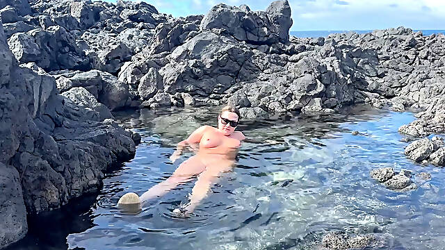 Nudist Girl Swimming Naked in the Natural Pool Outdoor