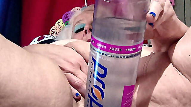 Big Bottle Plugged Clit Cunt